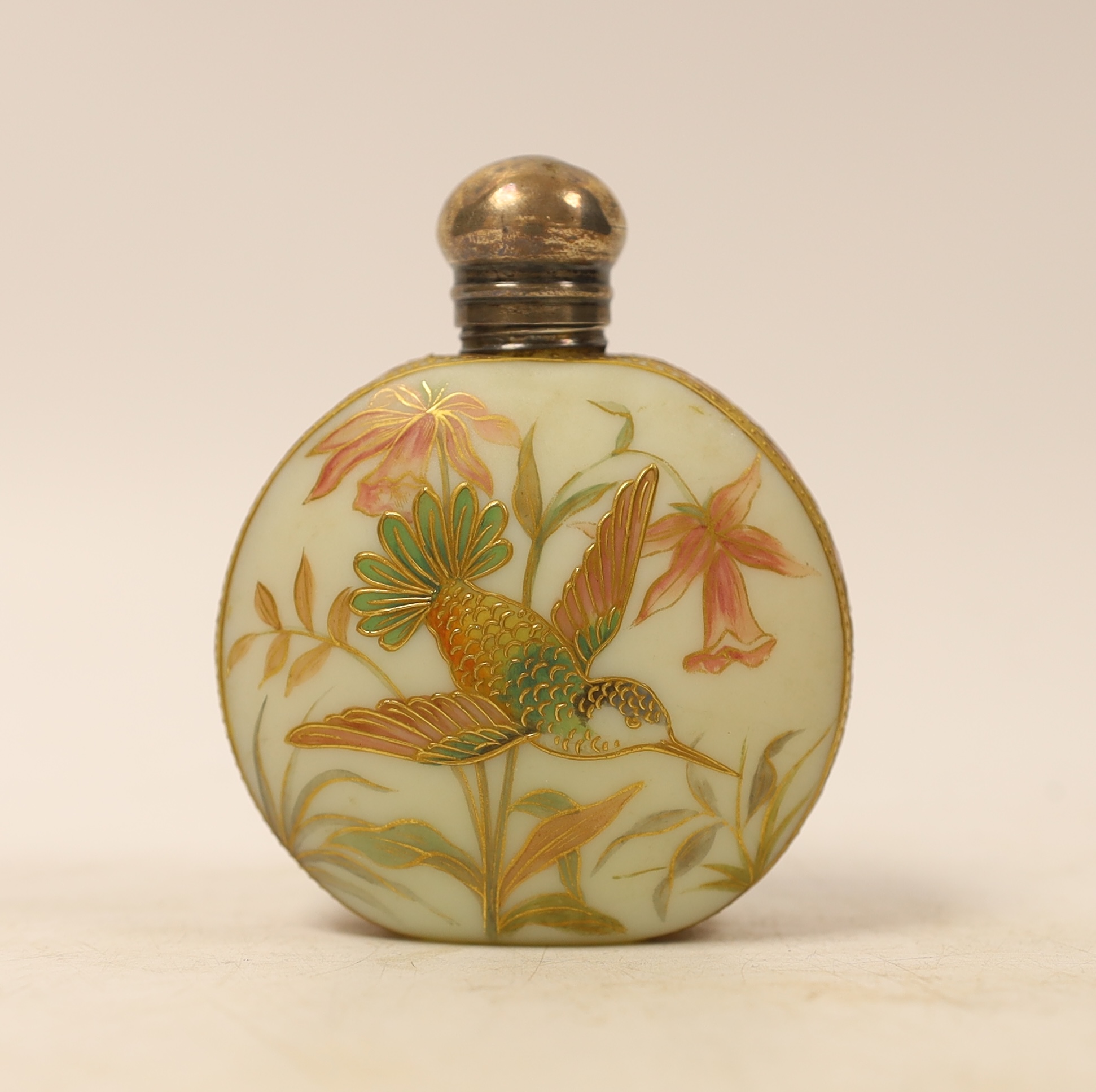 A late Victorian silver topped moon shaped opaline glass scent bottle, decorated with a bird and butterfly amongst flowers, William Oliver, Birmingham, 1894, 82mm.